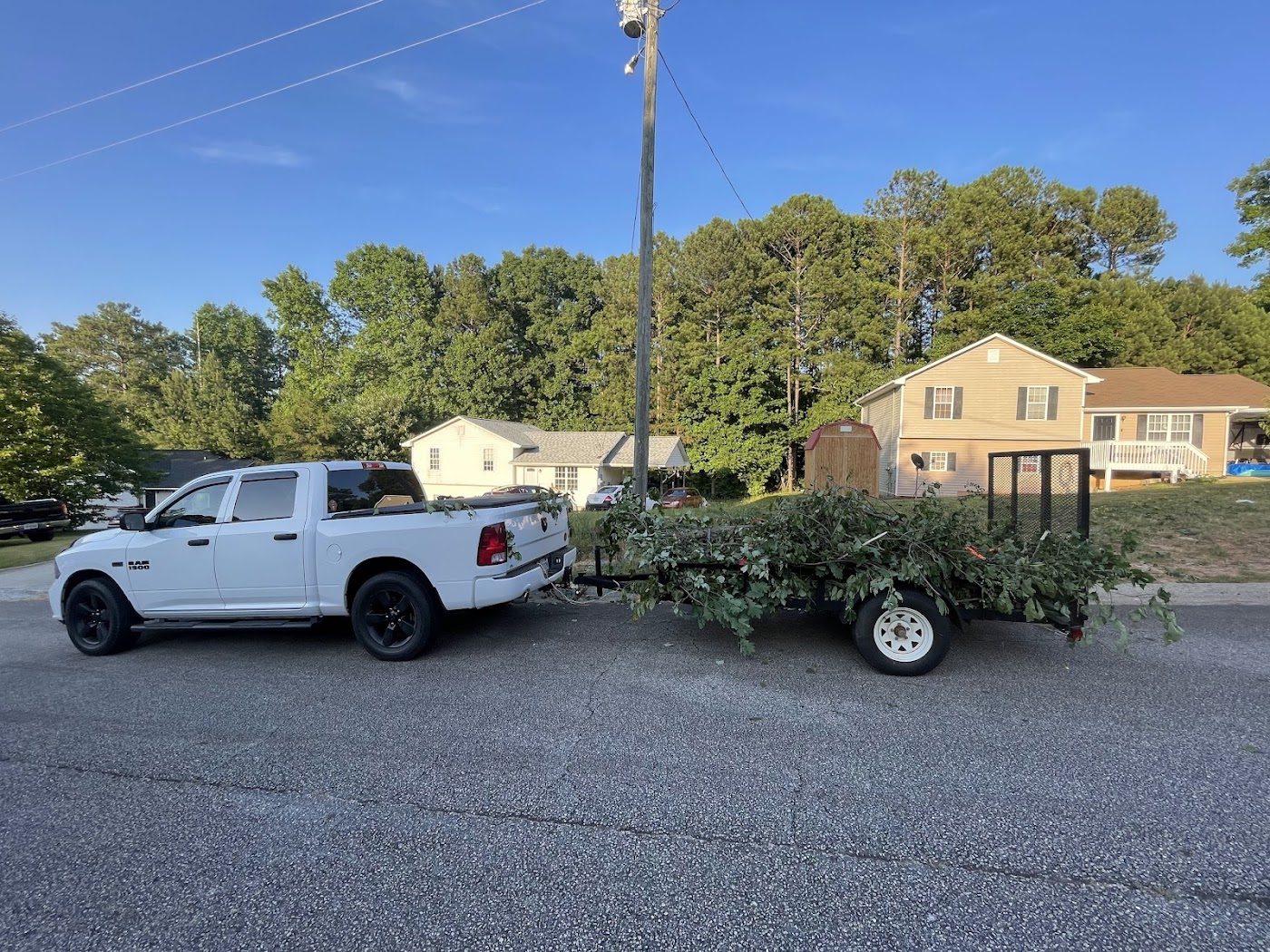 Truck and trailer loaded for a cleanup